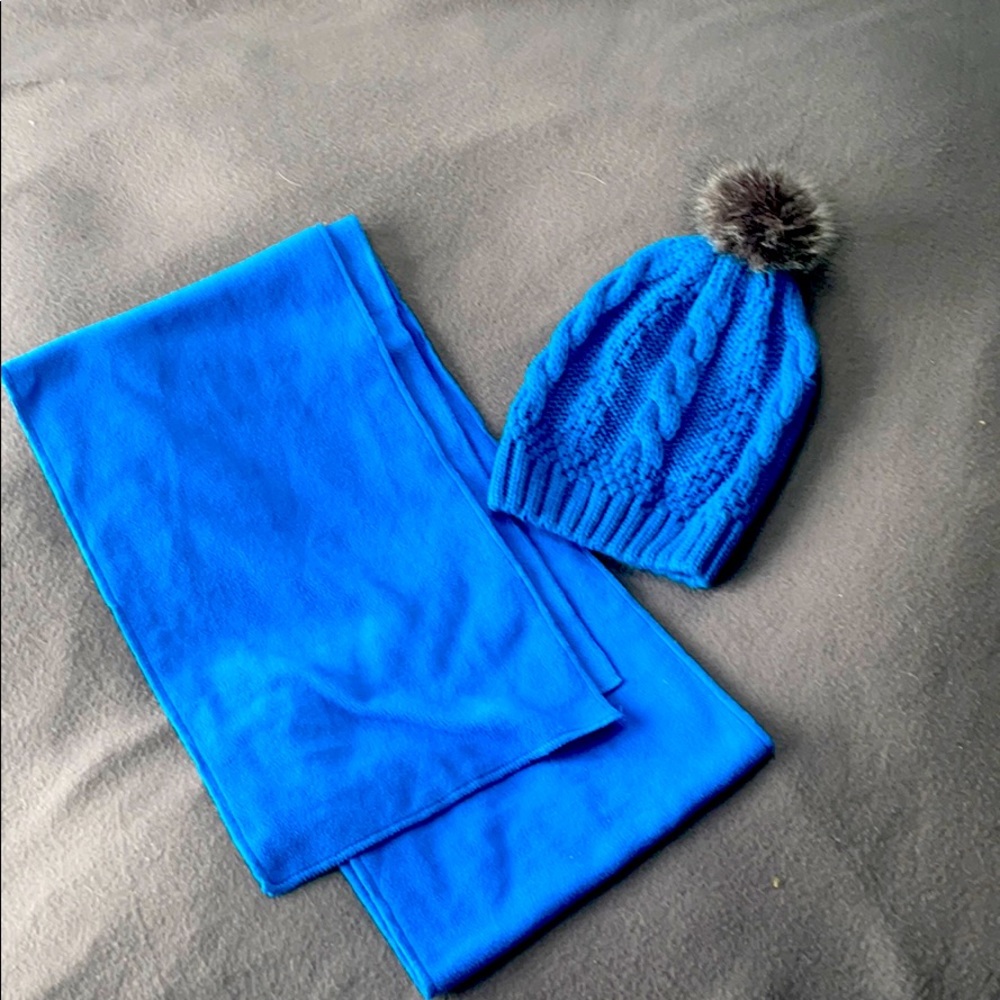 Bundle of blue knit beanie and scarf.